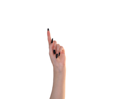 A woman's hand shows signs with her fingers. The "Victory hand" gesture. Isolation on a white background, studio photo.の写真素材