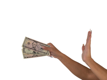 Robbery, extortion, crime. A frightened woman holds out money, dollar bills in her hands. Photo isolated on a white background.の写真素材