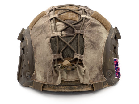 Us military tactical helmet for Chevron, case and straps Picatinny equipment. Photo isolated on a white background. The concept of weapons for airsoft and urban protests.の写真素材