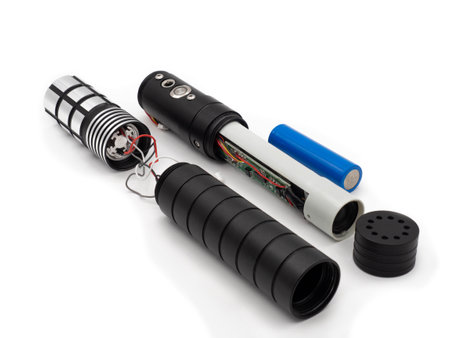Disassembled lightsaber or laser sword isolated on a white background. Saber handle without color beam. The concept of creating electronic cosplay toys.の写真素材