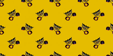 Classic Venetian theater mask with leather toy handcuffs isolated on a yellow pixel background....