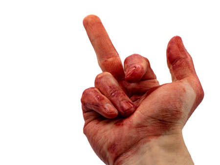 Man with a bloody hand shows his middle finger on a white background. Gesture, "fuck off" or "fuck you". Concept of protest, resistance to the authorities and the police, the insurgency. Hate people.の写真素材