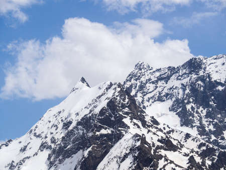 A landscape with a view of a mountain snow-covered peak. Travel, tourism to the Caucasus Mountains,...