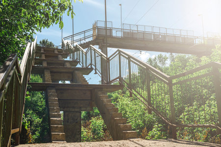 Disassembled staircase of a concrete bridge with missing steps. The concept of repair and restoration.の写真素材