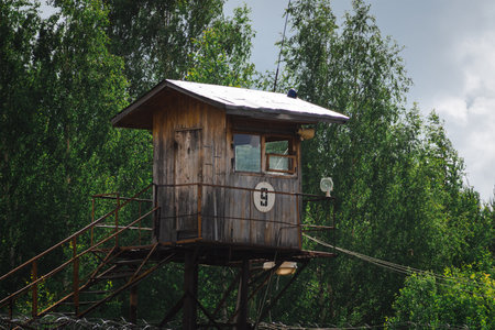 Watchtower with barbed wire at the prison camp. Russian guard tower.の写真素材