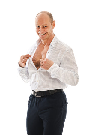 Portrait charismatic of a 50 year old man with a receding hairline in an unbuttoned white striped shirt. Photo in the studio on a white background.の写真素材
