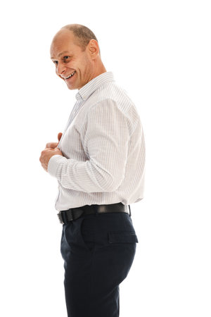 Portrait charismatic of a 50 year old man with a receding hairline in an unbuttoned white striped shirt. Photo in the studio on a white background.の写真素材