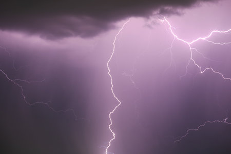 Lightning bolt in the dark night sky in close up.