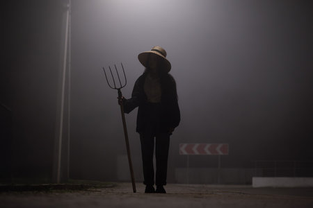 Woman with a pitchforkの写真素材