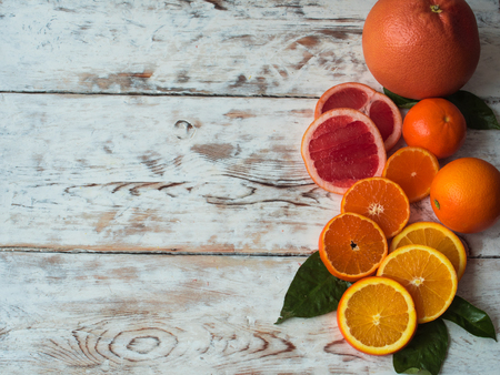 Various citrus fruits on wooden table. Free space for text .Top viewの写真素材