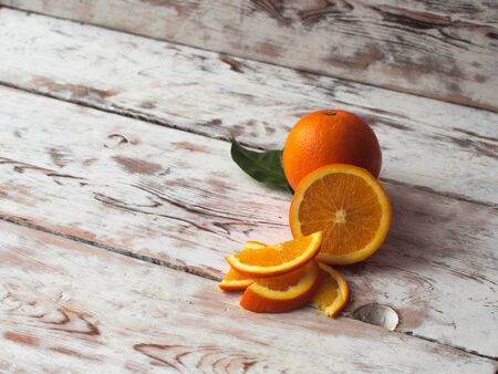Fresh ripe oranges on wooden table. Top view with copy space