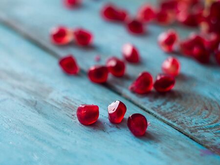 Seeds of pomegranate on vintage table. Macro, close upの写真素材