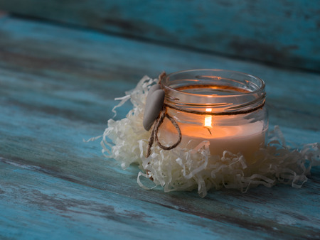 Beautiful candle on wooden background. Close upの写真素材