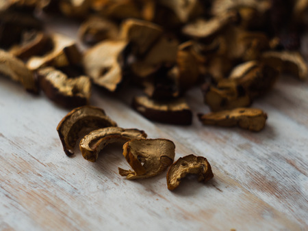 Dried Mushrooms on wooden background selective focus.の写真素材
