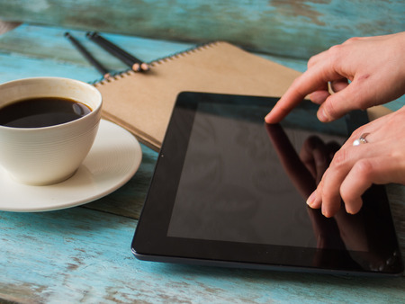 Woman using tablet in cafe close up.の写真素材