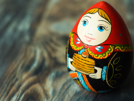 Close up of Russian traditional Doll. Wooden russian art. Homemade figureの写真素材