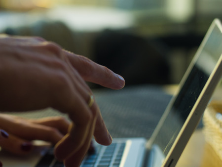 Side view of businessmans using computer in cafeの写真素材