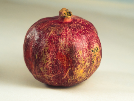 Red Pomegranate isolated on white background close upの写真素材