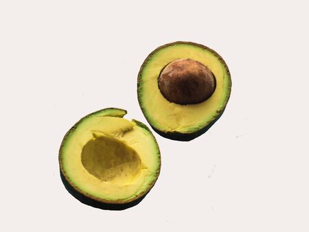 Organic ripe Avocado isolated on white background.