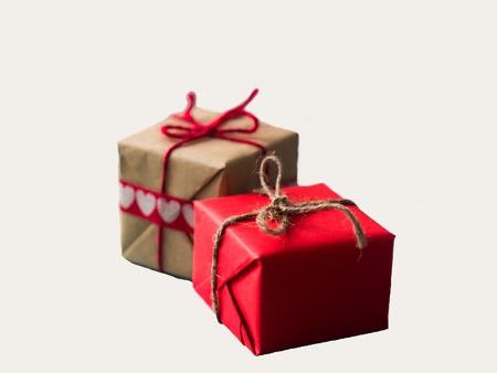 Red gift boxes with cotton ribbon isolated on white background.の写真素材