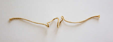 Small canvas rope on white background in the warm light.の写真素材