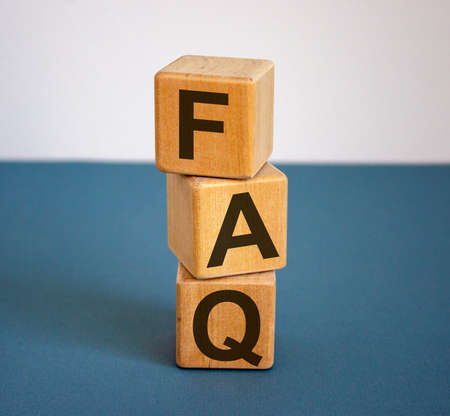 Concept word 'FAQ' on cubes on a beautiful blue background. Business concept.の写真素材