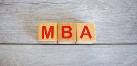 Concept word MBA on cubes on a beautiful white wooden table.の写真素材