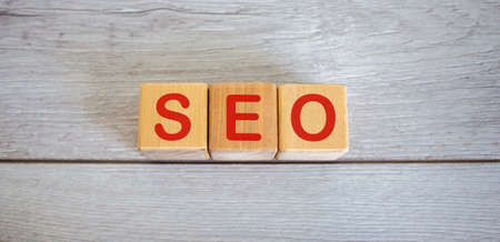 Concept word seo on cubes on a beautiful white wooden table.の写真素材