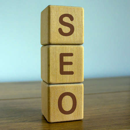 concept word seo on cubes on a beautiful blue backgroundの写真素材