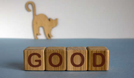 Wooden figures of the cat. The inscription don't worry, be happy.