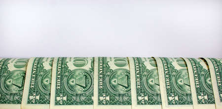 Concept business image. Dollar bills on a beautiful white background, copy space.の写真素材