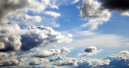 Sky with clouds and sun. Beautiful background, copy space.の写真素材