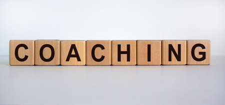 Concept word 'coaching' on cubes on a beautiful white background. Business concept. Copy space.の写真素材