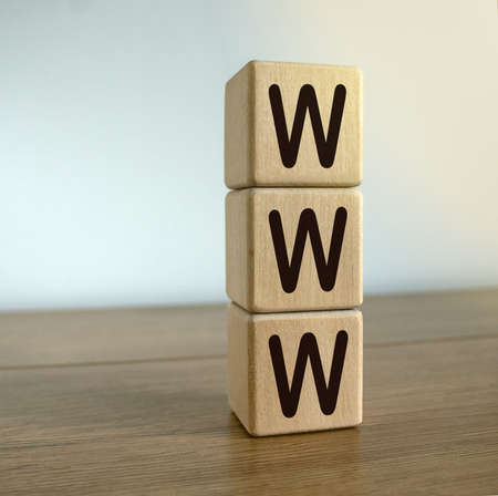 Concept sign 'www' on cubes on a beautiful wooden table.の写真素材