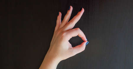 Woman's hand showing an Okay sign.の写真素材