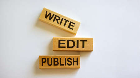Wooden blocks form the words 'write, edit, publish' on white background.の写真素材