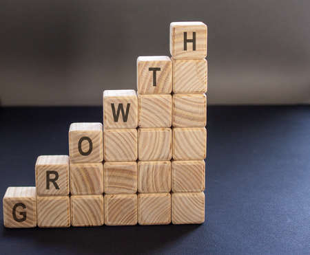 wooden stair made by wooden cube block with the inscription "growth"の写真素材