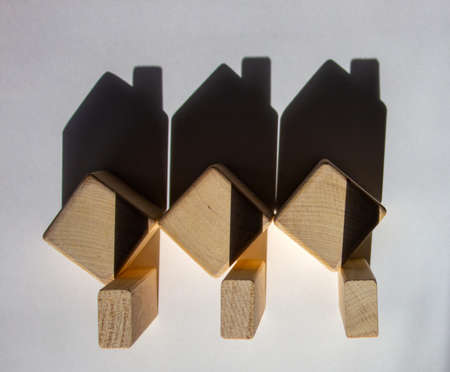 Houses created by shadows from wooden cubes. Copy space for your text.の写真素材