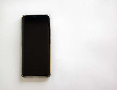 Black mobile phone isolated on white background. Concept image.の写真素材