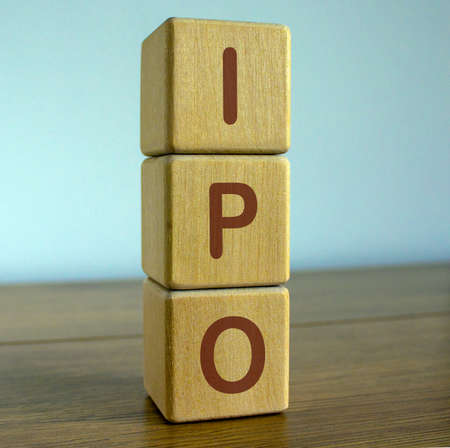 concept word IPO on cubes on a beautiful blue backgroundの写真素材
