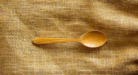 Beautiful wooden spoon isolated on canvas background. Concept.の写真素材