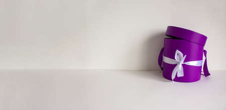 Round gift box on a beautiful white background. Copy space. Concept. Web banner.の写真素材