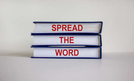 Books with text 'save your business' on beautiful wooden table. White background. Business concept. Copy space.の写真素材
