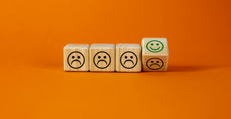 Various emoticons symbol. Turned a cube and changed negative smile to positive. Business and various emoticons concept. Beautiful white background, copy space. Image of quality and feedback.の写真素材