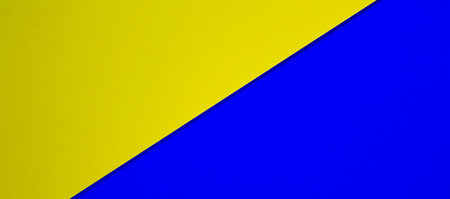 Colored paper texture. Geometric figure. Yellow color and blue color. Beautiful yellow and blue background. Concept.の写真素材