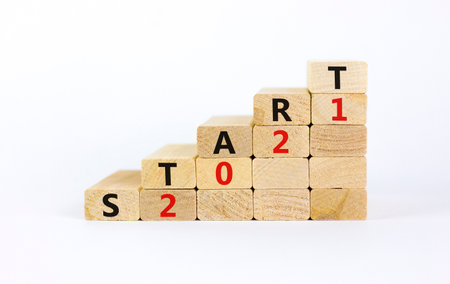 Business concept of 2021 new year start. Wooden blocks with words 'Start 2021'. Beautiful white background, copy space. 2021 new year start symbol.の写真素材