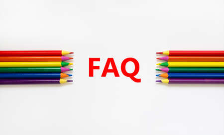 FAQ symbol. Concept word 'FAQ, frequently asked questions' on a beautiful white background. Colored pencils. Business and FAQ, frequently asked questions concept, copy space.の写真素材