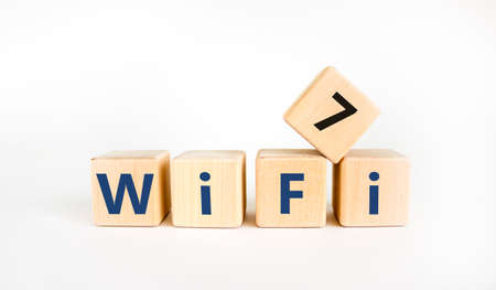 WiFi 7 symbol. The concept word WiFi 7 on wooden cubes. Beautiful white table, white background, copy space. Business, technology and WiFi 7 or WiFi7 concept.の写真素材