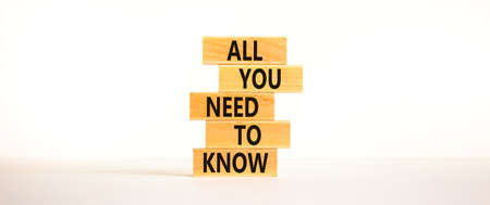 All you need to know symbol. Wooden blocks with words All you need to know on beautiful white...