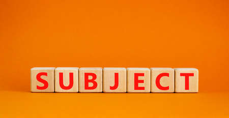 Subject symbol. The concept word Subject on wooden cubes. Beautiful orange table, orange background, copy space. Business and subject concept.の写真素材
